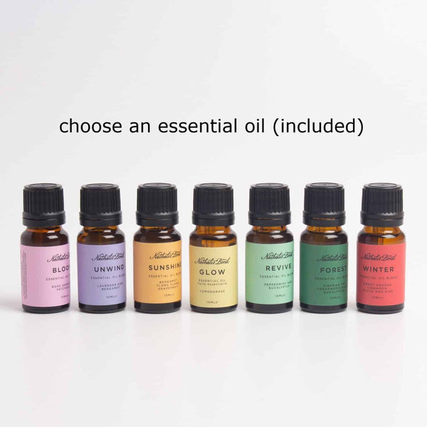 Seven bottles of essential oils with colourful labels