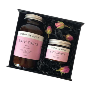Bath salts and a soy candle in a black gift box