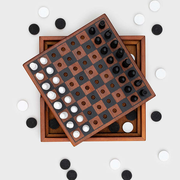 A chess and checkers board game with playing pieces scattered around it