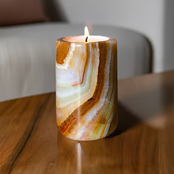 An onyx stone candle in a cosy lounge