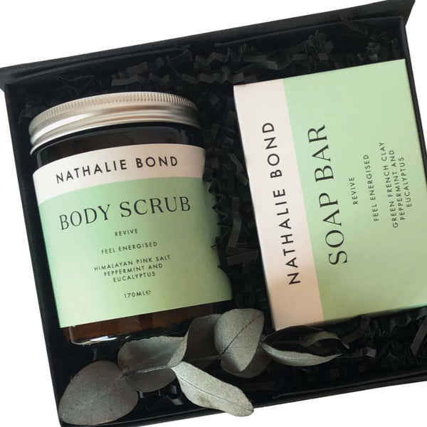 Close up of a Body scrub and soap bar in a gift box