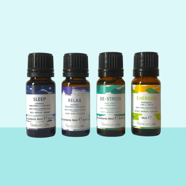 Four essential oil bottles with the words sleep, relax, de-stress and energise