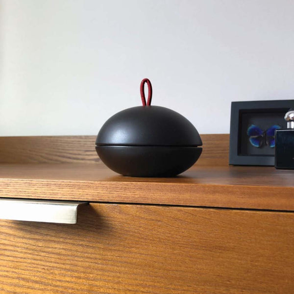 An aromatherapy diffuser on a bedside table