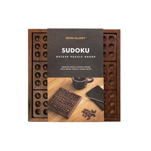 A wooden Sudoku game in its packaging